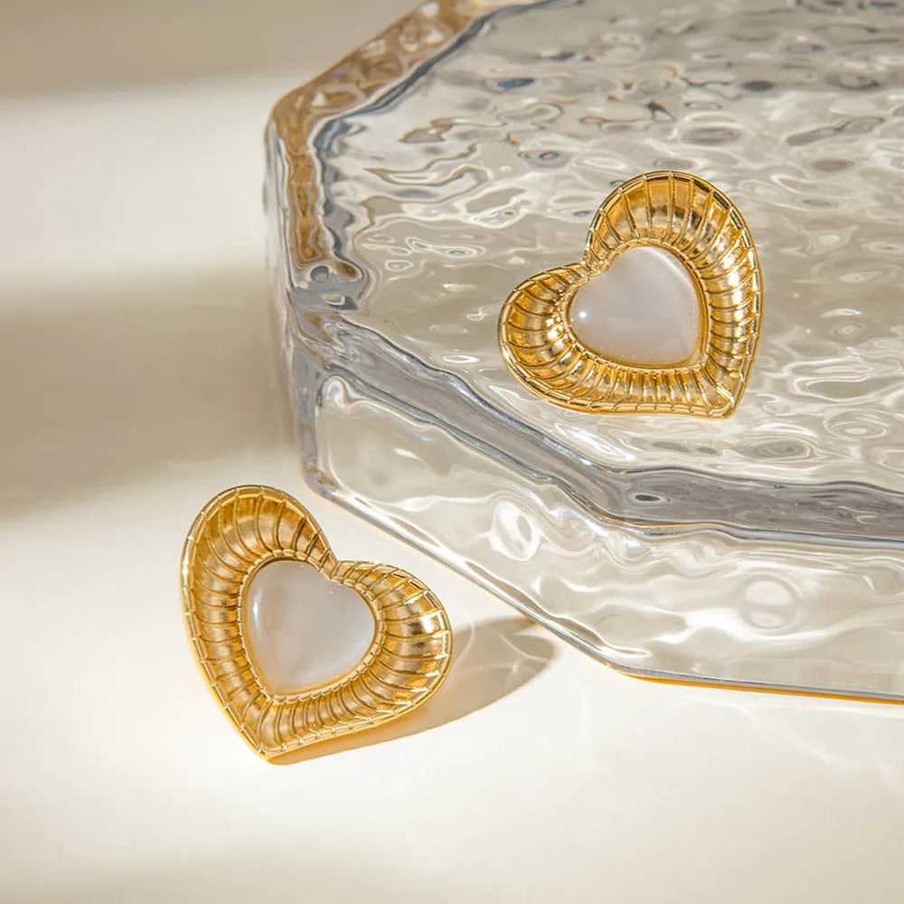 White cat eye stone earrings with niche temperament titanium steel earrings