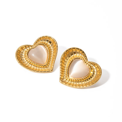 White cat eye stone earrings with niche temperament titanium steel earrings